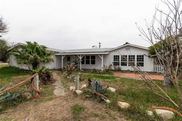 back of house featuring a garage