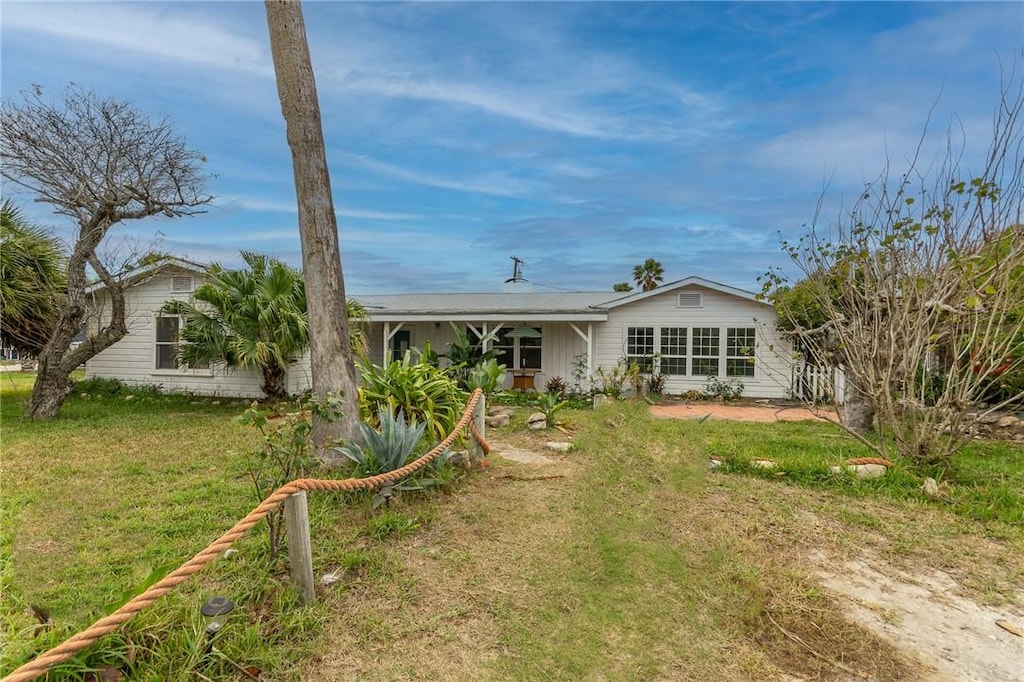 736 E Cotter Ave, Port Aransas, TX 78373 - view of front of home featuring a front yard