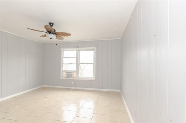 tiled empty room featuring crown molding and ceiling fan