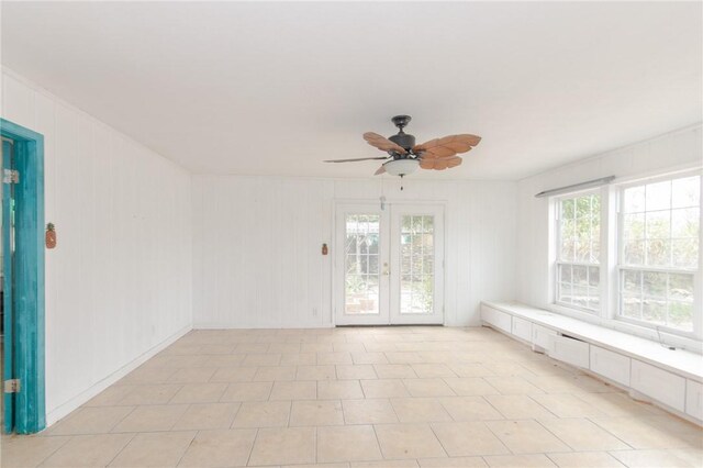 interior space featuring ceiling fan and french doors