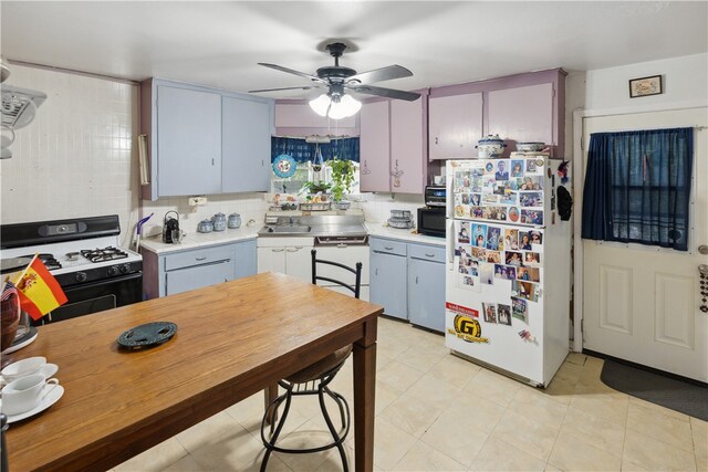 kitchen with backsplash, white appliances, light tile patterned floors, and ceiling fan