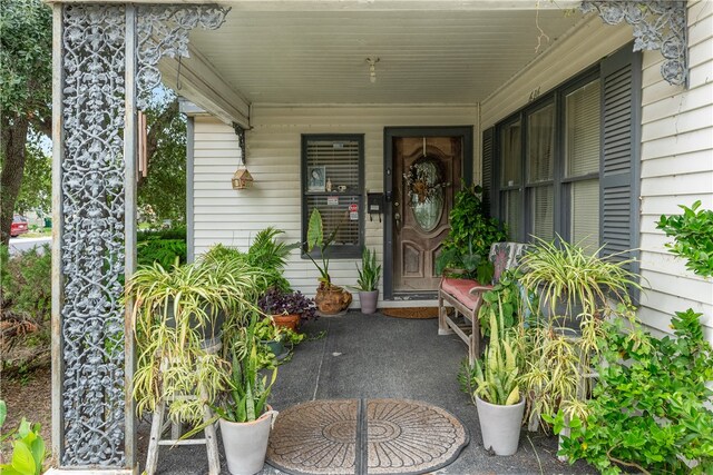 doorway to property with a porch