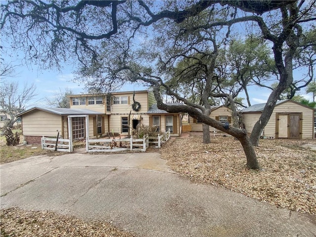 view of front of home with a storage unit