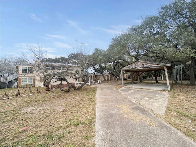 view of front facade with a carport