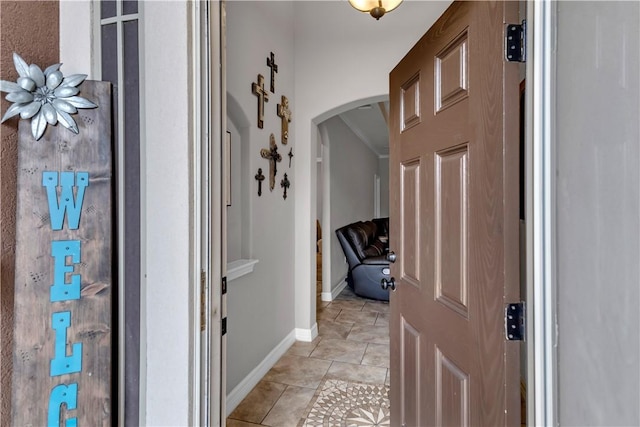 hallway featuring light tile patterned floors