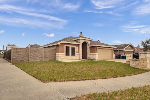 ranch-style home featuring a garage and a front yard