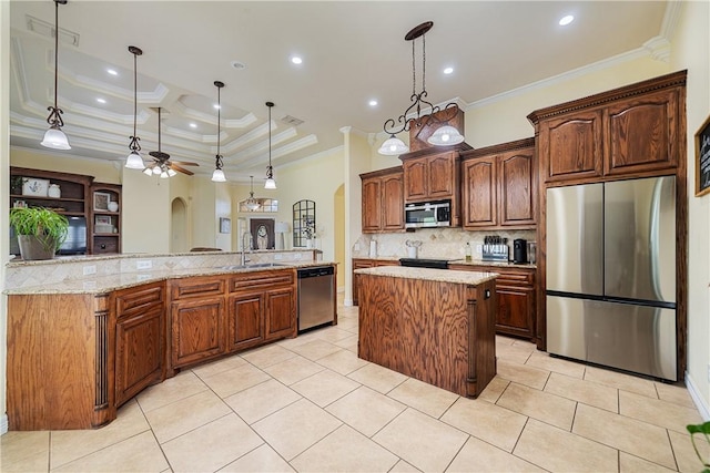 11330 Brendel, Corpus Christi, TX 78410 - kitchen featuring stainless steel appliances, a spacious island, arched walkways, crown molding, and tasteful backsplash