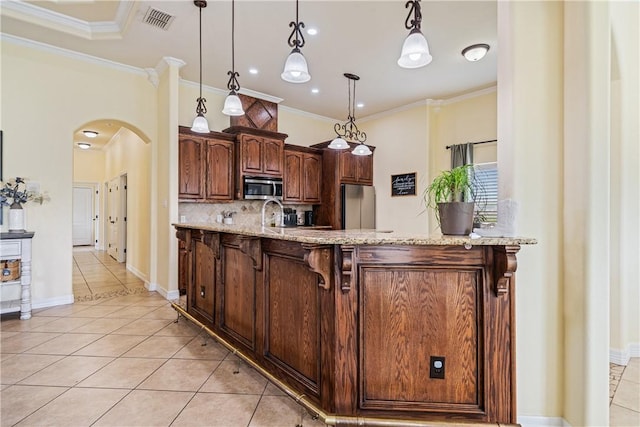 11330 Brendel, Corpus Christi, TX 78410 - kitchen featuring appliances with stainless steel finishes, light tile patterned flooring, arched walkways, tasteful backsplash, and crown molding