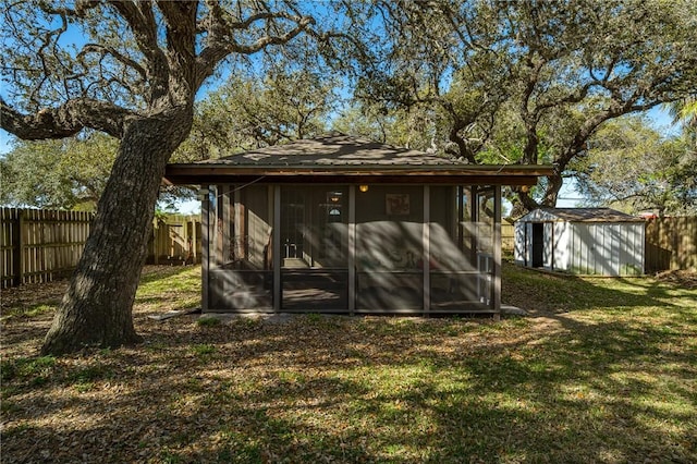 view of shed with a fenced backyard