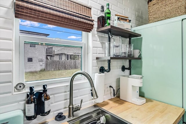 interior space featuring wood-type flooring, plenty of natural light, and sink