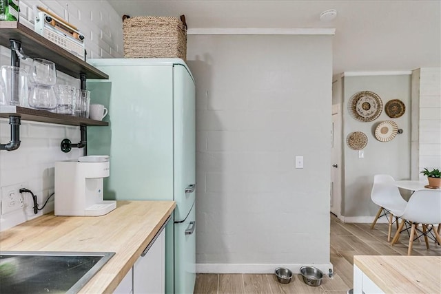 interior space featuring white fridge and black electric stovetop