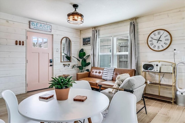 dining space with wooden walls