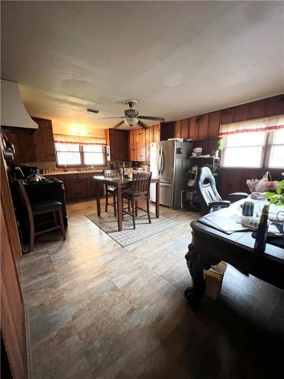 dining space featuring a wealth of natural light and ceiling fan