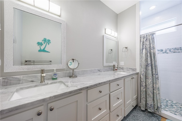 bathroom with vanity and a shower with shower curtain