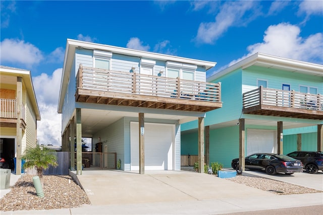 view of front of house with a garage, a carport, and a balcony