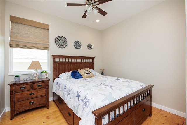 bedroom featuring light hardwood / wood-style floors and ceiling fan