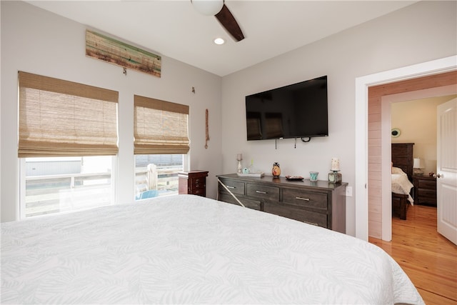 bedroom featuring ceiling fan and light hardwood / wood-style flooring