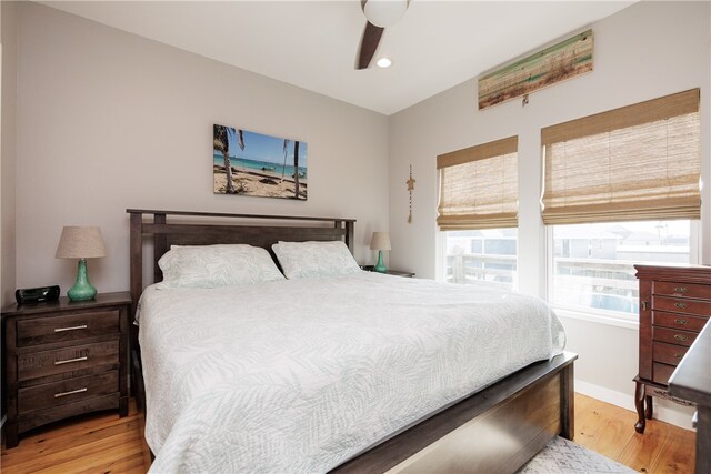 bedroom with ceiling fan and light hardwood / wood-style flooring