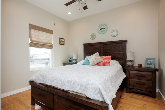 bedroom featuring light hardwood / wood-style floors and ceiling fan