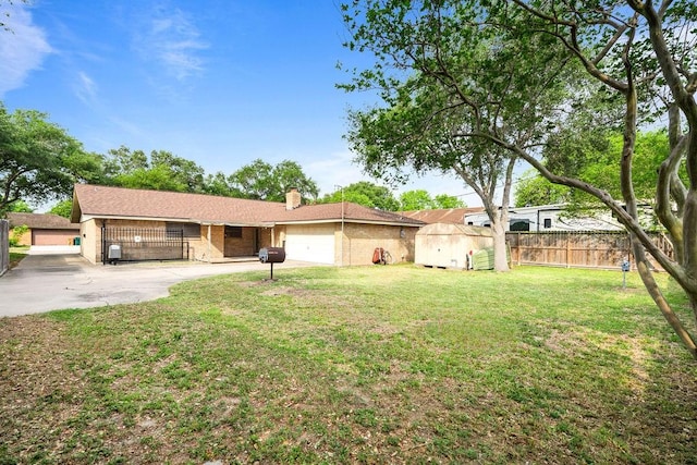 10710 Atlanta St, Corpus Christi, TX 78410 - back of house featuring concrete driveway, an attached garage, and a chimney