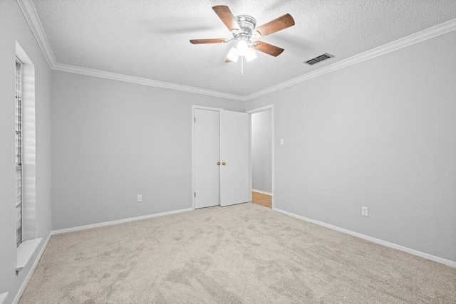 10710 Atlanta St, Corpus Christi, TX 78410 - unfurnished bedroom with a textured ceiling, carpet flooring, ornamental molding, a ceiling fan, and baseboards