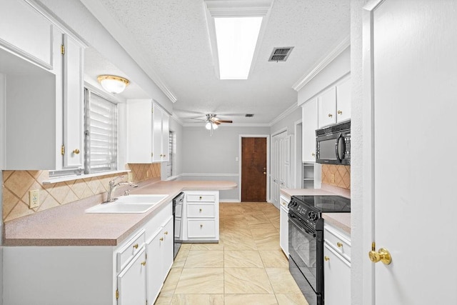 10710 Atlanta St, Corpus Christi, TX 78410 - kitchen with black appliances, a sink, crown molding, white cabinets, and tasteful backsplash
