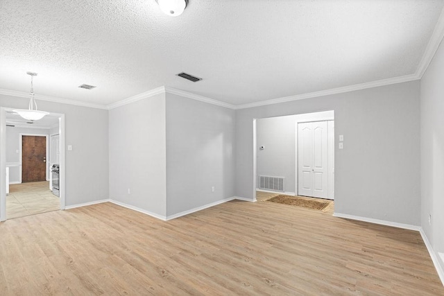 10710 Atlanta St, Corpus Christi, TX 78410 - spare room with light wood finished floors, crown molding, baseboards, and a textured ceiling