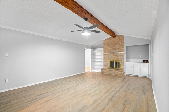 10710 Atlanta St, Corpus Christi, TX 78410 - unfurnished living room with ceiling fan, light wood-type flooring, a textured ceiling, baseboards, and a fireplace
