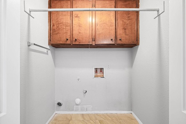 10710 Atlanta St, Corpus Christi, TX 78410 - laundry room featuring gas dryer hookup, washer hookup, cabinet space, baseboards, and hookup for an electric dryer