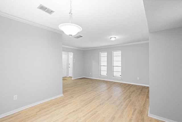 10710 Atlanta St, Corpus Christi, TX 78410 - unfurnished room featuring ornamental molding, light wood finished floors, baseboards, and a textured ceiling