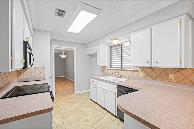 10710 Atlanta St, Corpus Christi, TX 78410 - kitchen with black appliances, a sink, crown molding, white cabinets, and backsplash