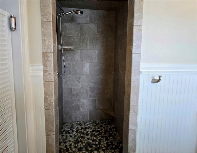 515 Deforrest St, Corpus Christi, TX 78404 - bathroom with a wainscoted wall and a tile shower