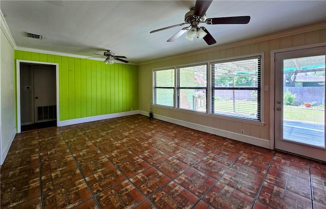 515 Deforrest St, Corpus Christi, TX 78404 - empty room with ornamental molding, ceiling fan, healthy amount of natural light, and wood walls