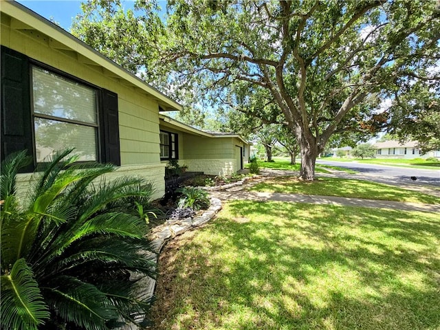 515 Deforrest St, Corpus Christi, TX 78404 - view of green lawn featuring an attached garage