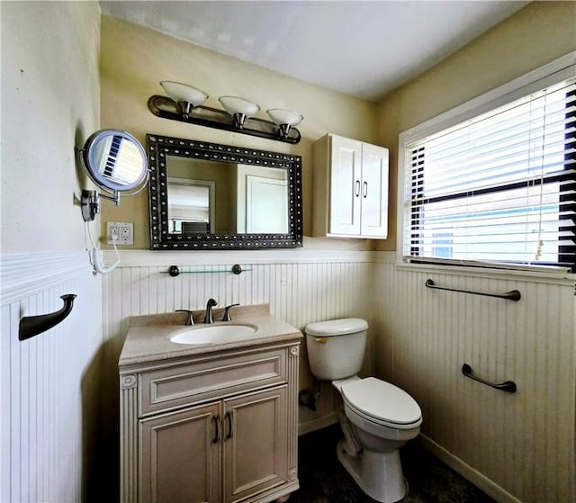 515 Deforrest St, Corpus Christi, TX 78404 - bathroom with a wainscoted wall, vanity, and healthy amount of natural light