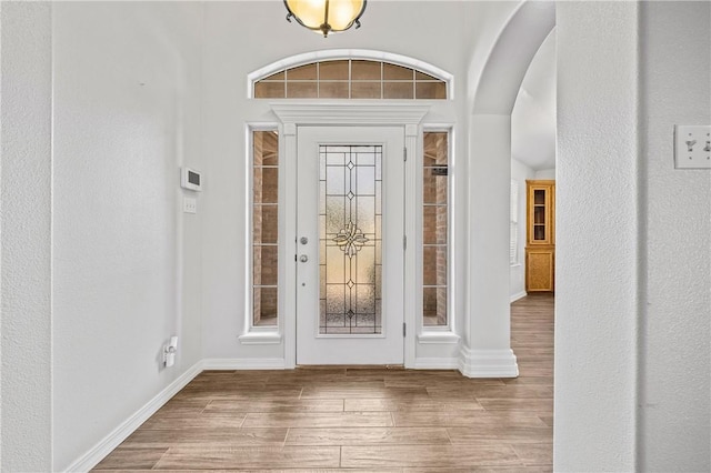 entryway with hardwood / wood-style floors