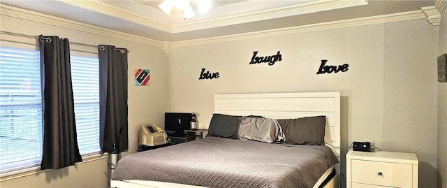 bedroom with crown molding