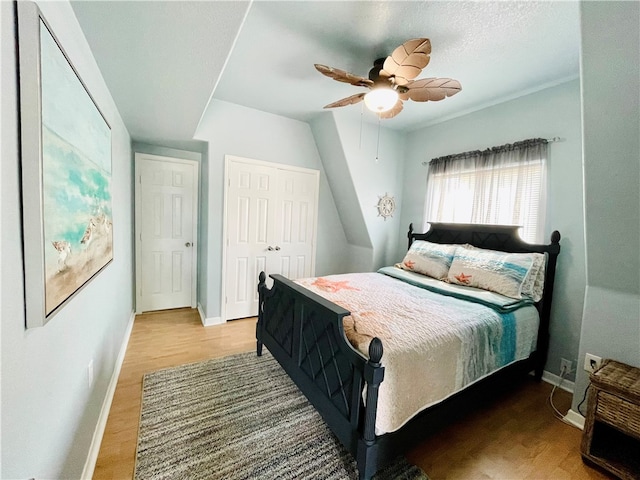 343 Bracht, Rockport, TX 78382 - bedroom with baseboards, wood finished floors, a closet, and a ceiling fan