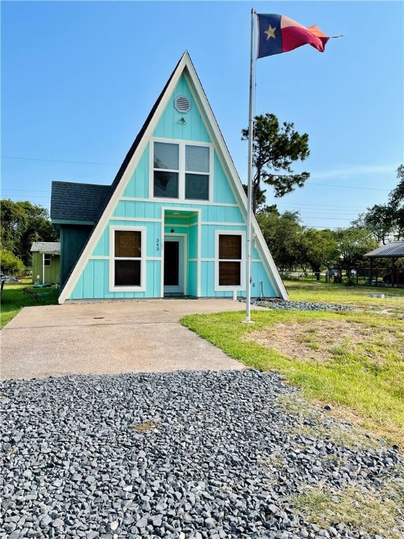 343 Bracht, Rockport, TX 78382 - a-frame home featuring board and batten siding and a shingled roof
