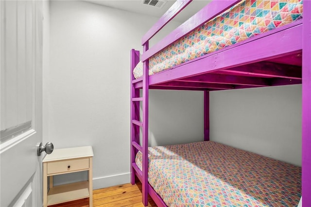 bedroom featuring hardwood / wood-style flooring