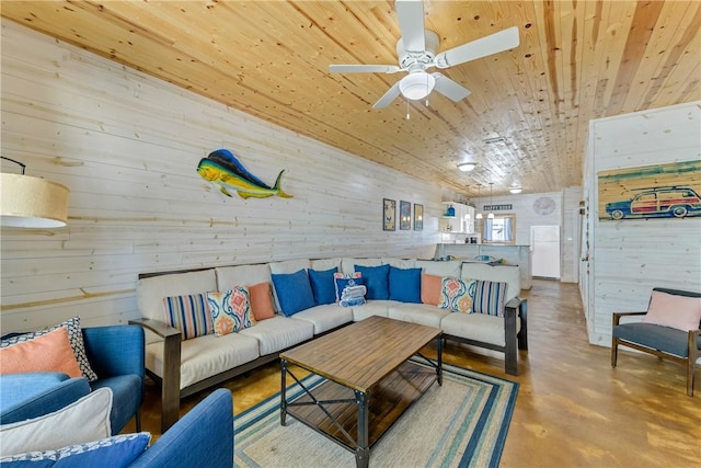 living room featuring wood ceiling, ceiling fan, and concrete floors