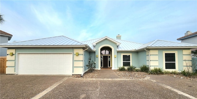 single story home featuring a garage