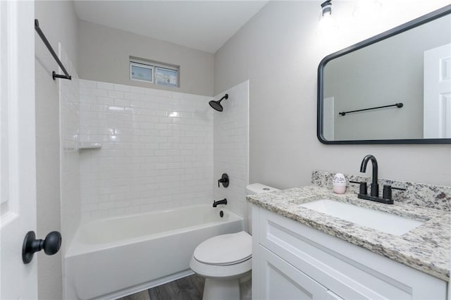 full bathroom featuring shower / tub combination, toilet, vanity, and hardwood / wood-style flooring