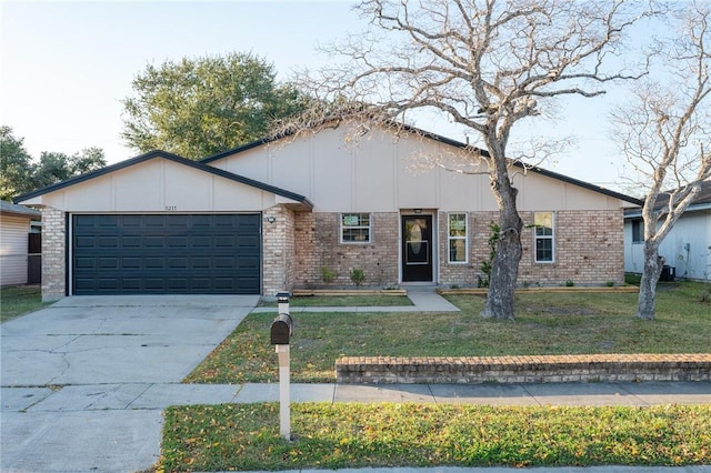 ranch-style home featuring a front yard and a garage