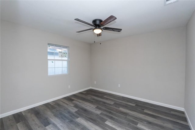 empty room featuring dark hardwood / wood-style floors and ceiling fan