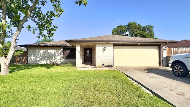 single story home featuring a garage and a front yard