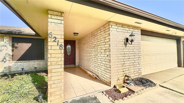 doorway to property featuring a garage