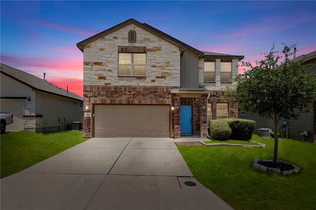10343 Rosalina Loop, Converse, TX 78109 - view of front of property featuring an attached garage, concrete driveway, a yard, stone siding, and brick siding