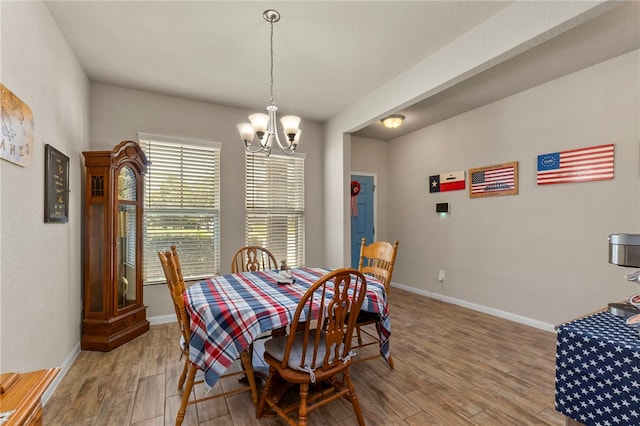 10343 Rosalina Loop, Converse, TX 78109 - dining area featuring a chandelier and wood finished floors
