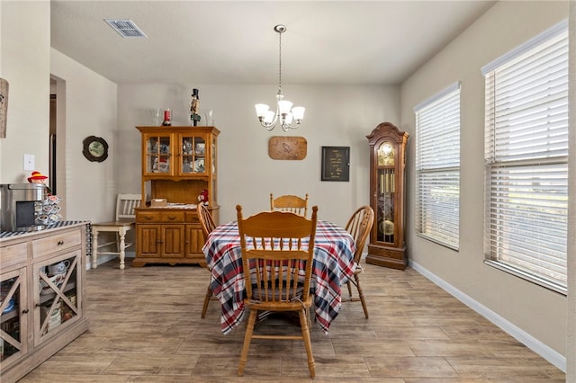 10343 Rosalina Loop, Converse, TX 78109 - dining space with a chandelier and light wood-type flooring